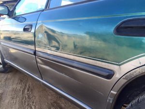 green-subaru-fix-car-door-damage