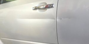before-white-car-door-scratch-repair-weaverville-asheville-wnc